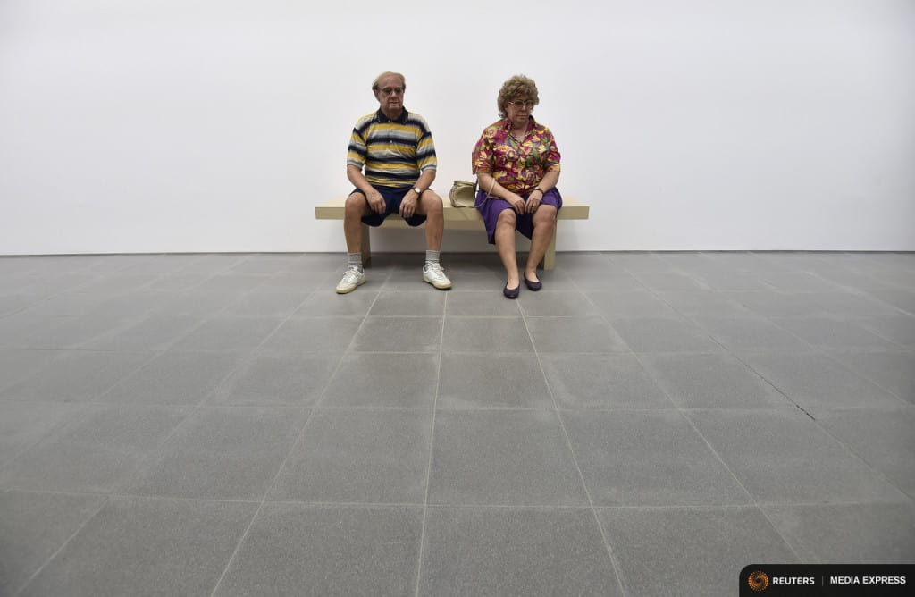 A sculpture entitled 'Old Couple on a Bench' by the late U.S. artist Duane Hanson is exhibited at the Serpentine Sackler Gallery in London, June 1, 2015. Hanson's lifelike sculptures portraying working-class Americans and overlooked members of society are being brought together in the largest show of his work in Britain since 1997. REUTERS/Toby Melville TPX IMAGES OF THE DAY