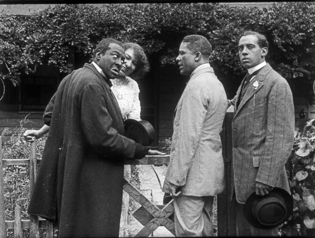 Scene still Bert Williams Lime Kiln Field Day Project. From left to right: Bert Williams, Odessa Warren Grey, unidentified, Walker Thompson